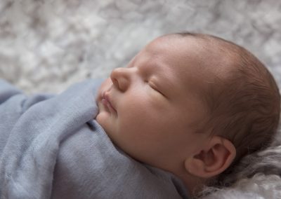 Baby boy on white background for newborn photoshoot