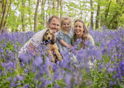 Family in the bluebells near Towcester by Miranda Walton Photography