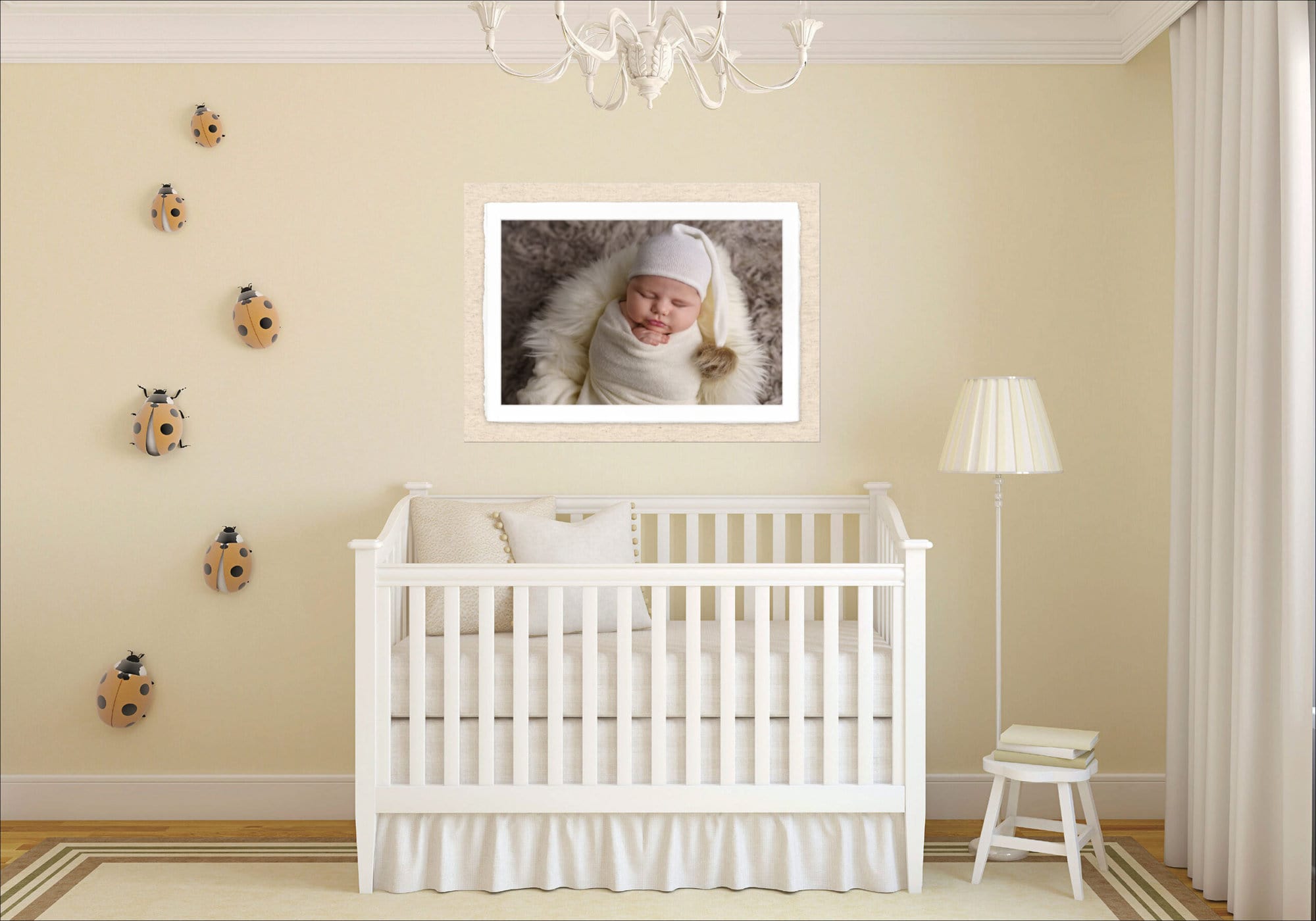 baby's nursery showing a photo of the baby above the cot