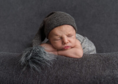 newborn photographer in Northampton, baby boy on grey blanket