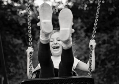 Day in the Life Photography - at home in Northamptonshire child on swing