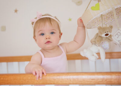 Day in the Life Photography - at home in Northamptonshire baby standing in cot