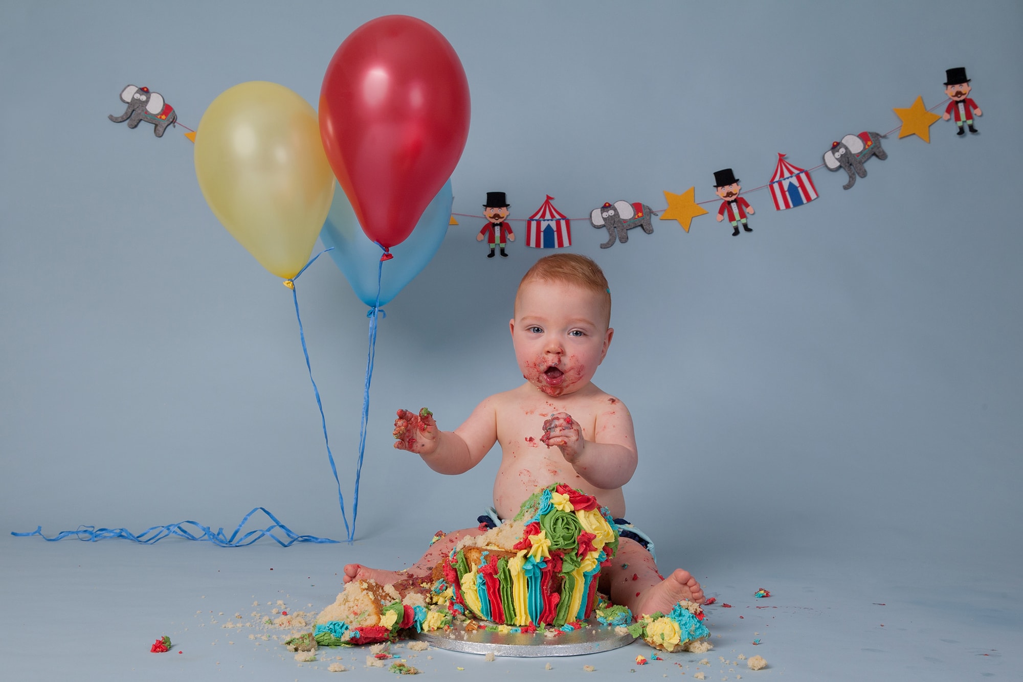 cake smash photoshoot with baby boy and circus theme