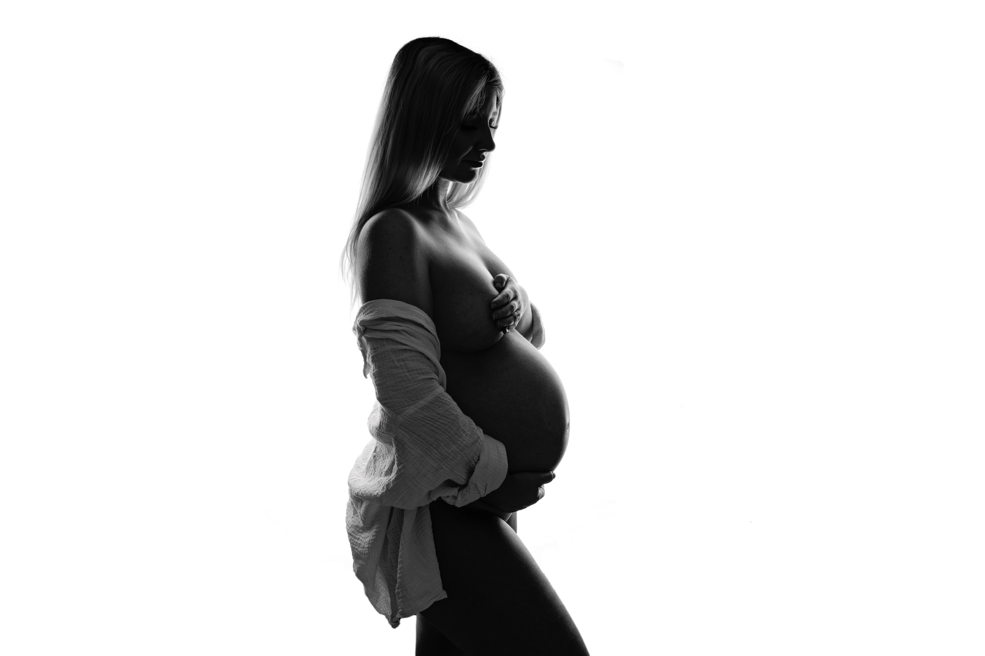 black and white photograph of a pregnant woman
