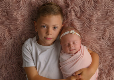 newborn photography with baby and big brother