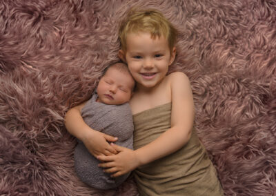 newborn photography with baby and big sister